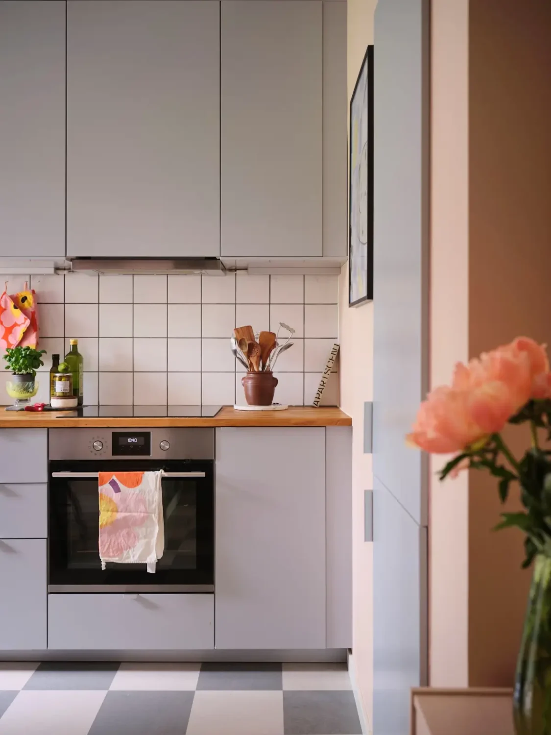 A Natural Color Palette in a Swedish 1940s Apartment 14 gray kitchen cabinets checkered floor