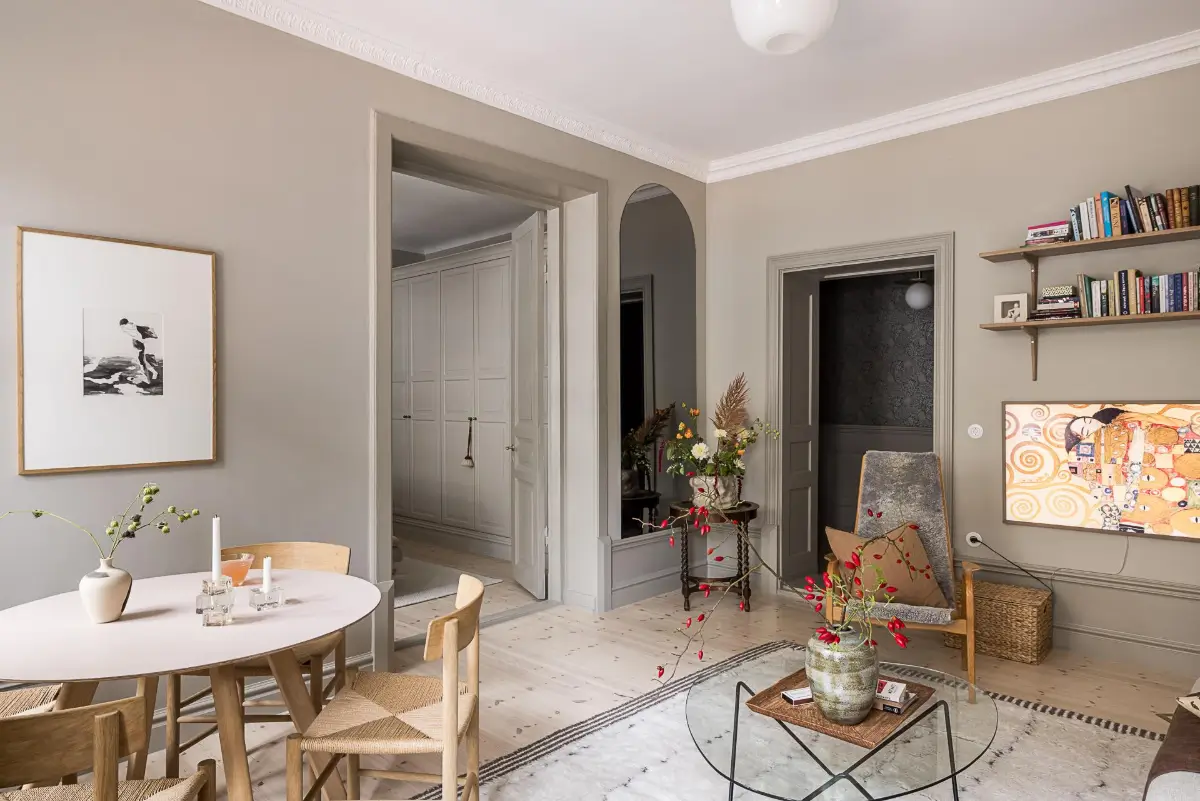 Gray Tones, Wallpapers, and a Mint Green Fireplace in a Swedish Apartment 12 gray living room arched mirror