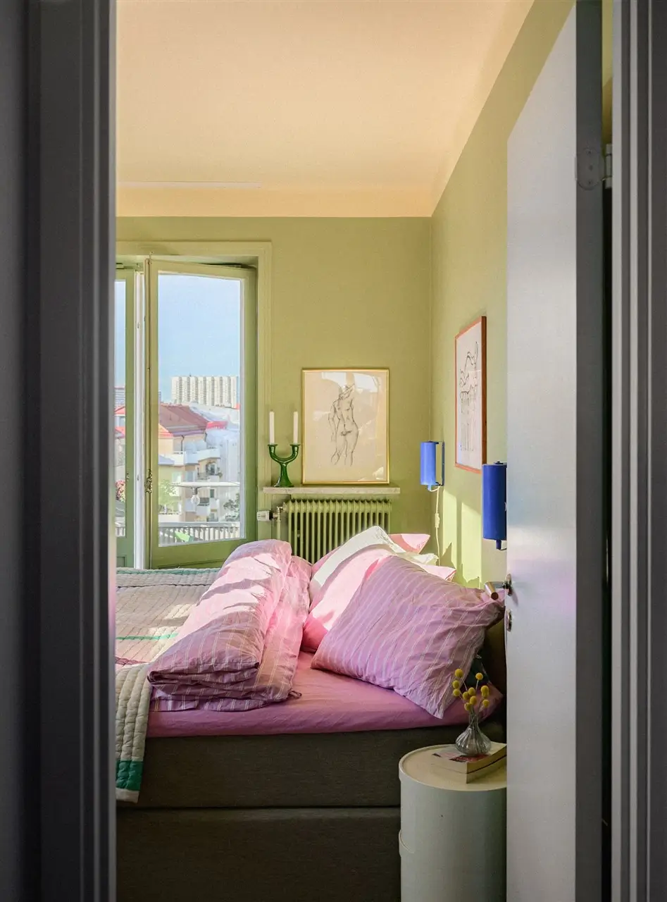 A Colorful Stockholm Family Apartment with Views of the Lake 19 green bedroom glass balcony doors