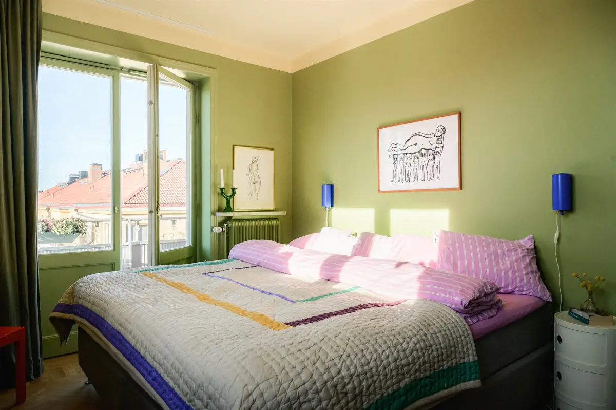 A Colorful Stockholm Family Apartment with Views of the Lake 20 green bedroom striped pink bedding nordroom