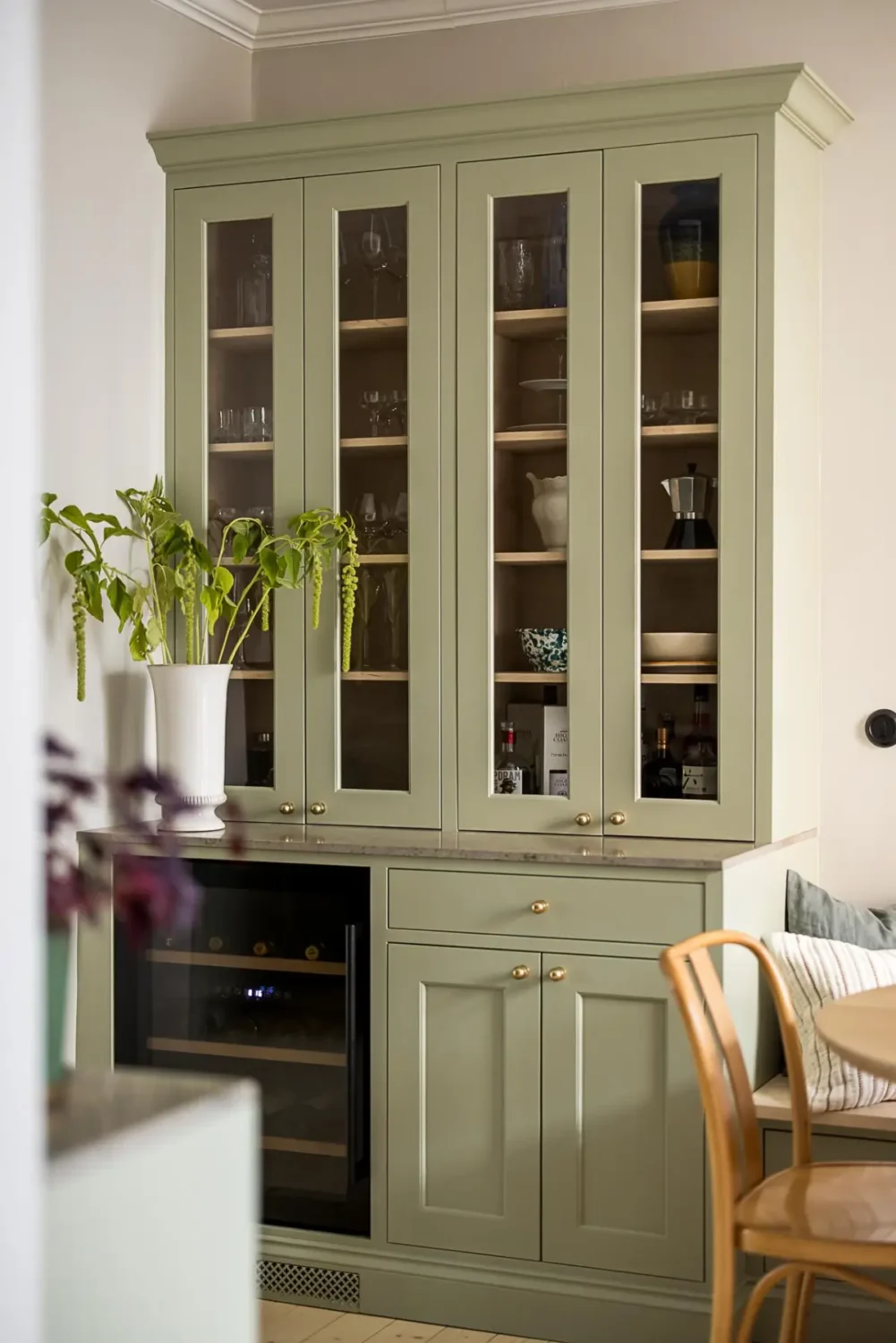 A Classic Renovated Apartment with a Social Light Green Kitchen 25 green glass cabinets