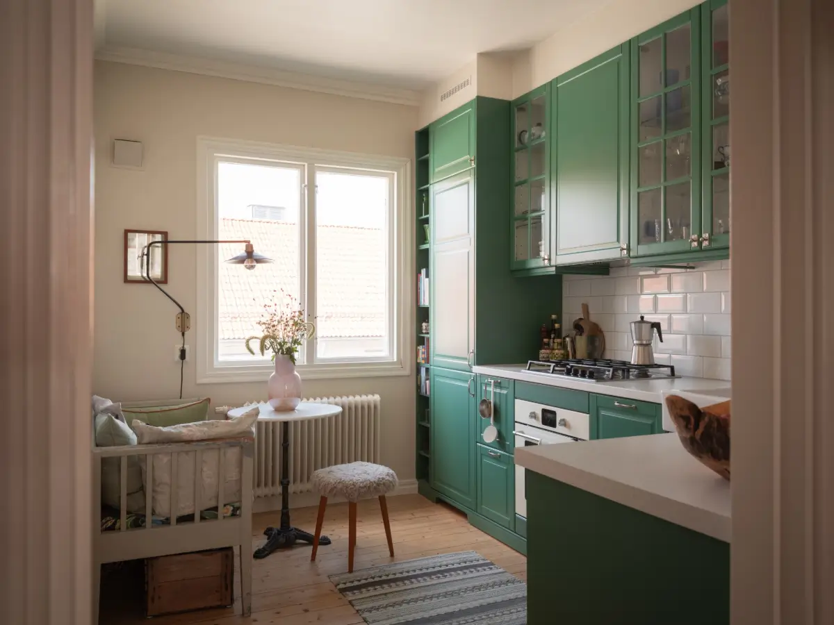 The Color Trends for 2026: A Return to Nature, Balance, and Grounding 30 green-kitchen-cabinets-small-table-with-bench-nordroom