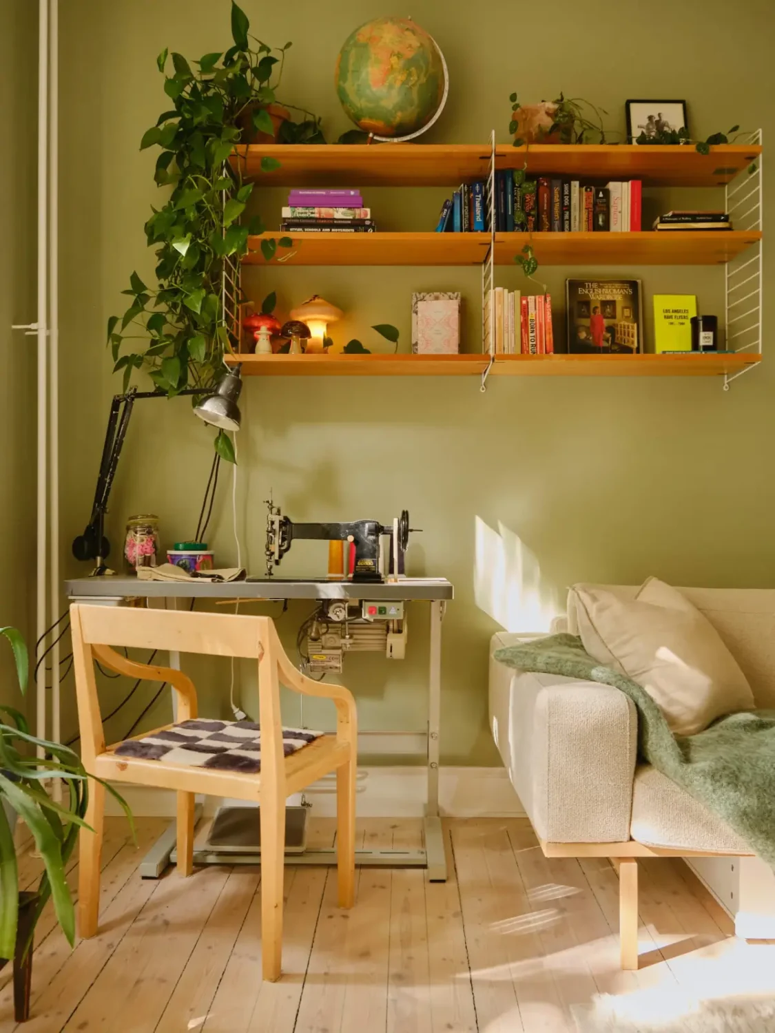 Green and Apricot Rooms in a Charming Stockholm Apartment 6 green living room sewing corner