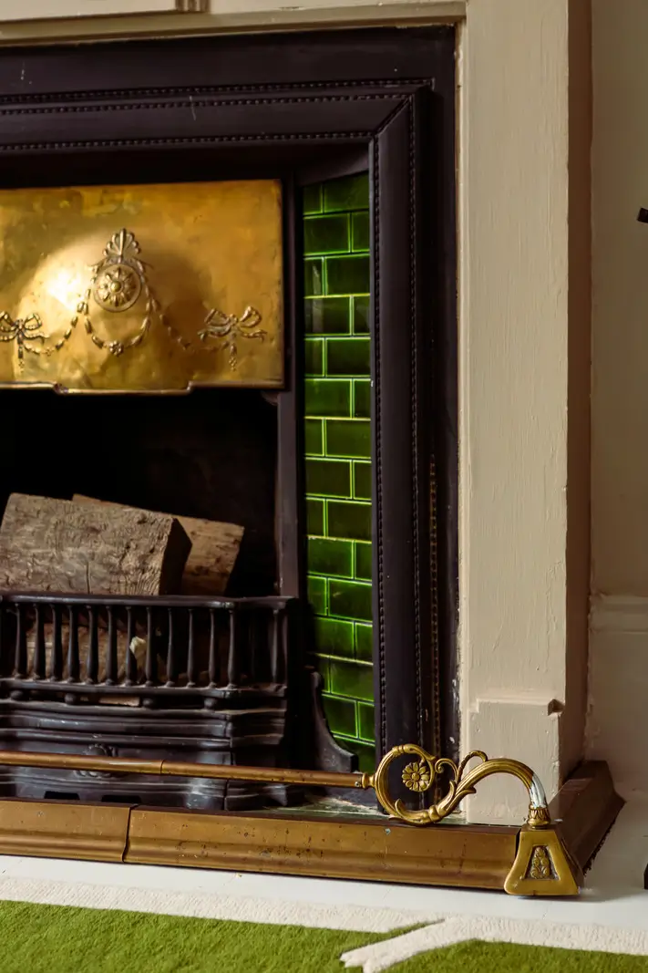 Period Elements and Subtle Color Accents in a Victorian Family Home 3 green tiles fireplace detail