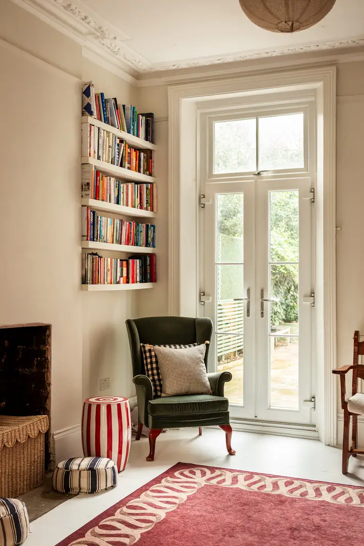 Period Elements and Subtle Color Accents in a Victorian Family Home 8 green velvet reading chair