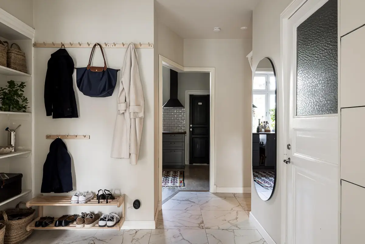 Warm Neutral Tones and Period Features in a Swedish Apartment 27 hall marble floor tiles Warm Neutral Tones and Period Features in a Swedish Apartment