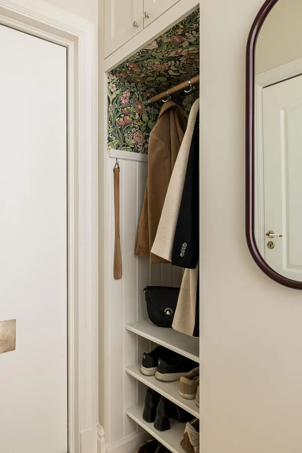 A Classic Renovated Apartment with a Social Light Green Kitchen 37 hall niche for coats and shoes