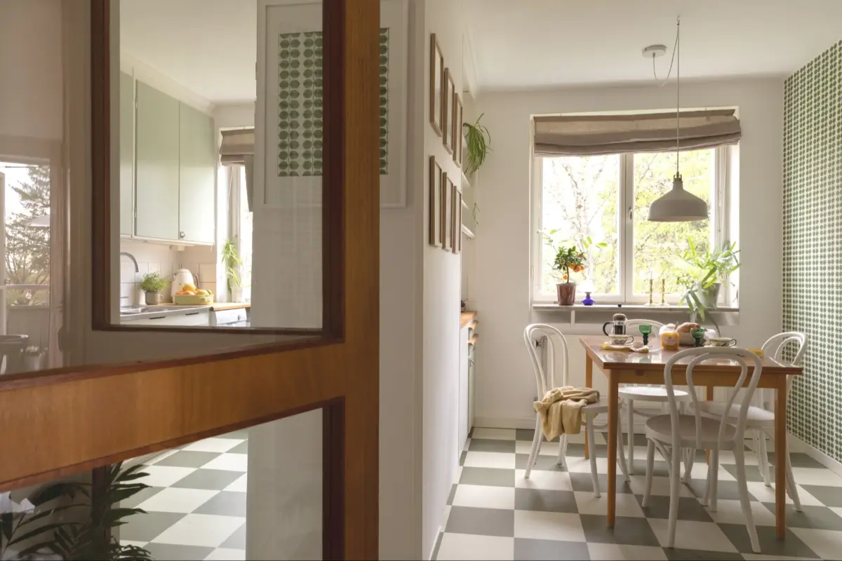 A Well-Preserved 1950s Apartment North of Stockholm 11 kitchen and dining space midcentury style checkerboard floor