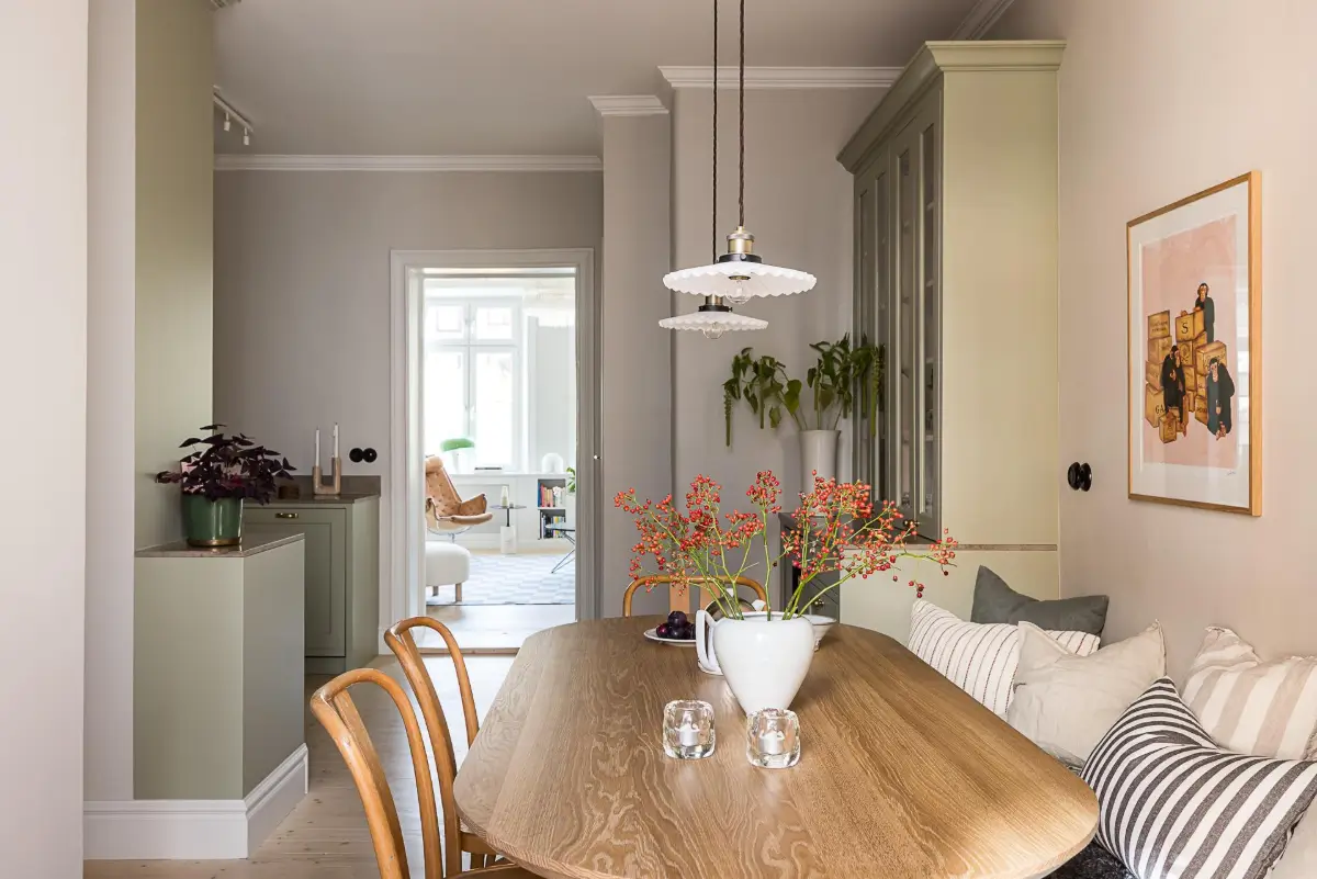 A Classic Renovated Apartment with a Social Light Green Kitchen 27 kitchen dining table
