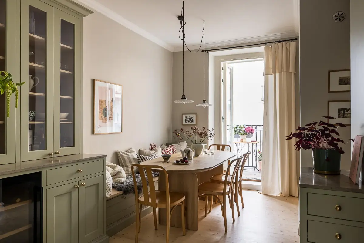 A Classic Renovated Apartment with a Social Light Green Kitchen 28 kitchen dining table with bench