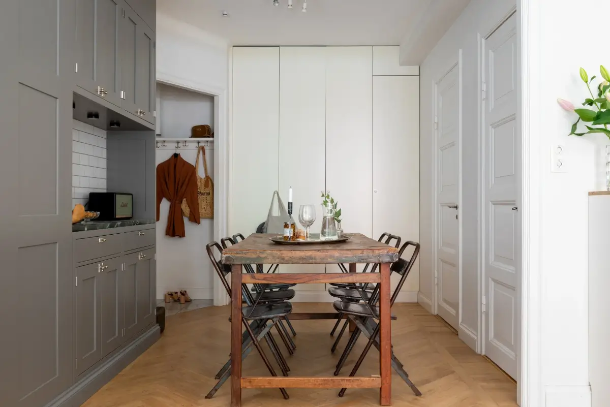 A Gray Kitchen with a Green Marble Countertop in a Small Apartment 17 kitchen gray cabinets dining space