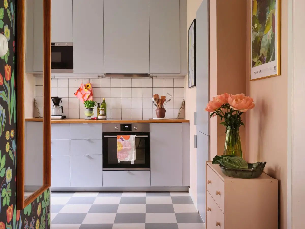 A Natural Color Palette in a Swedish 1940s Apartment 12 kitchen light gray cabinets