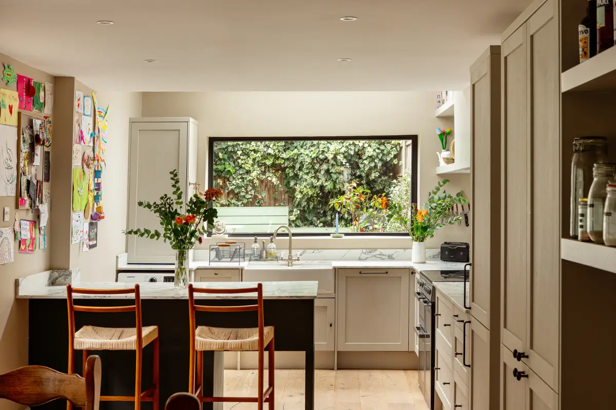 Period Elements and Subtle Color Accents in a Victorian Family Home 11 kitchen picture window butler sink