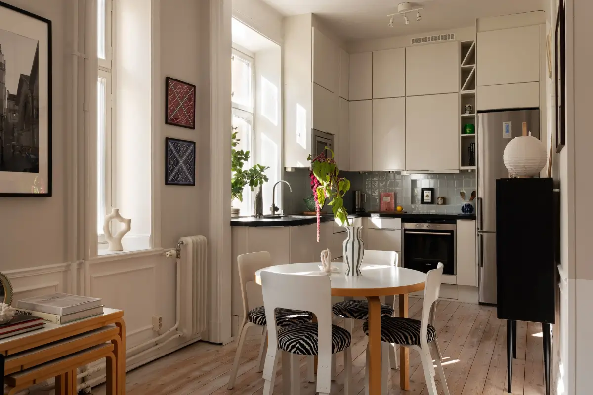 Neutral Tones and Period Character from the 1910s in a Stockholm Apartment 13 kitchen round dining table