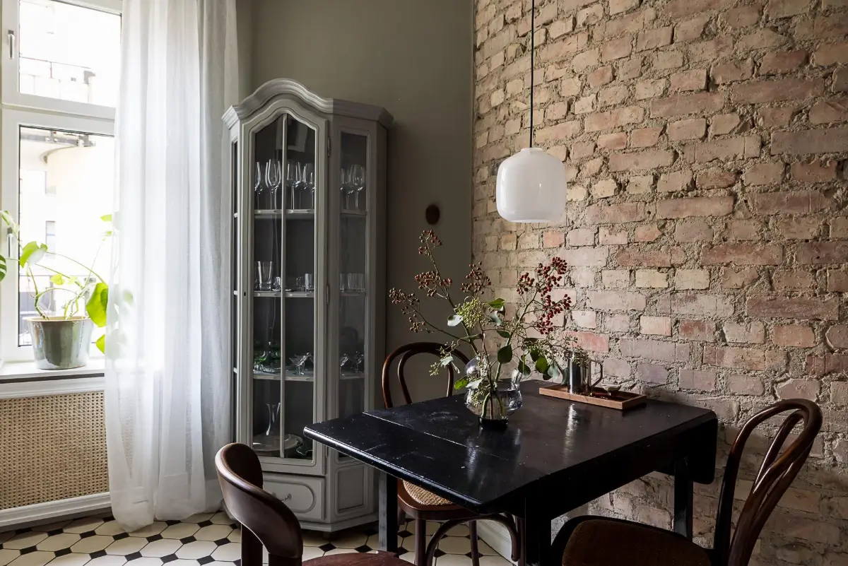 Gray Tones, Wallpapers, and a Mint Green Fireplace in a Swedish Apartment 25 kitchen small black folding table brick wall