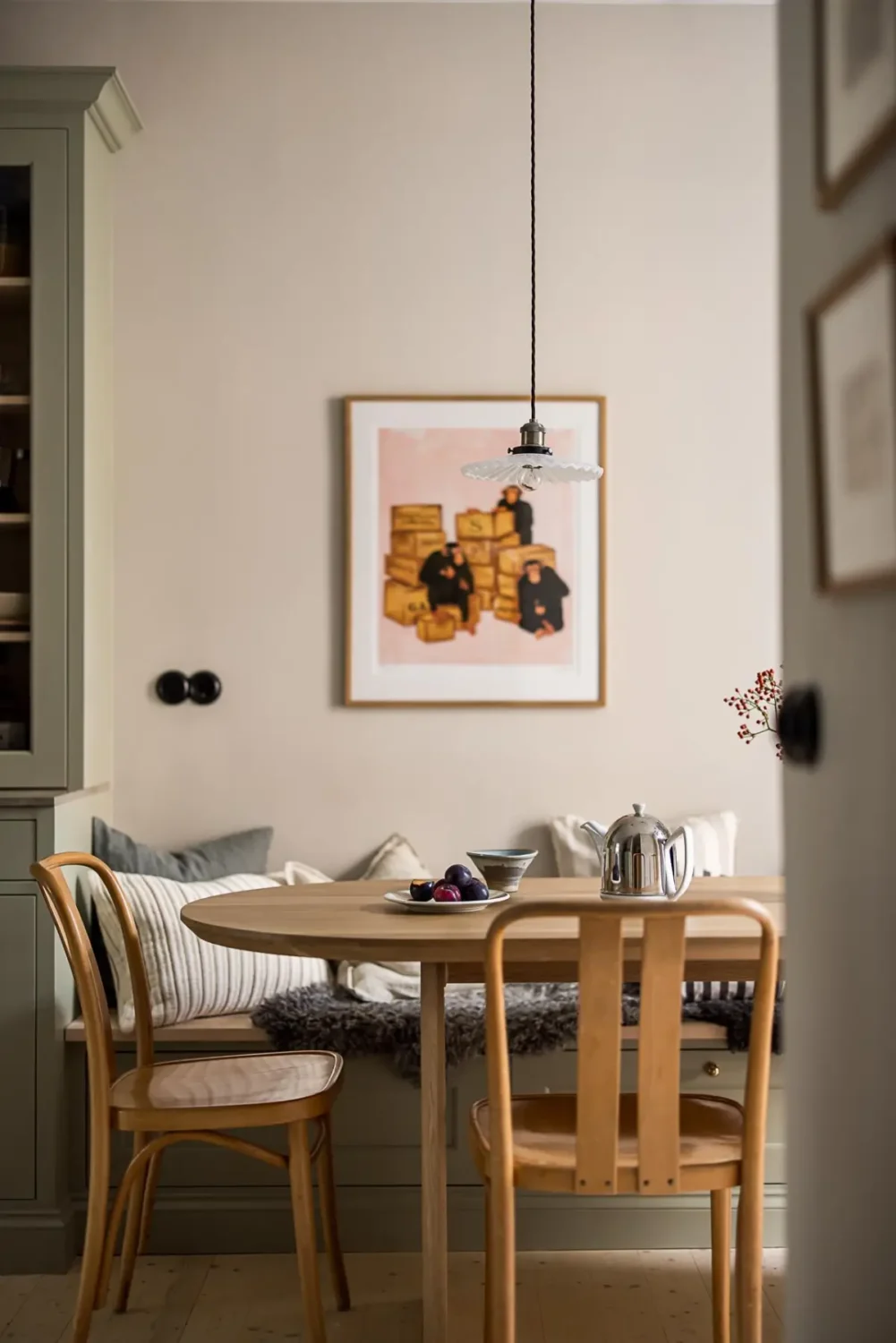 A Classic Renovated Apartment with a Social Light Green Kitchen 29 kitchen table with storage bench