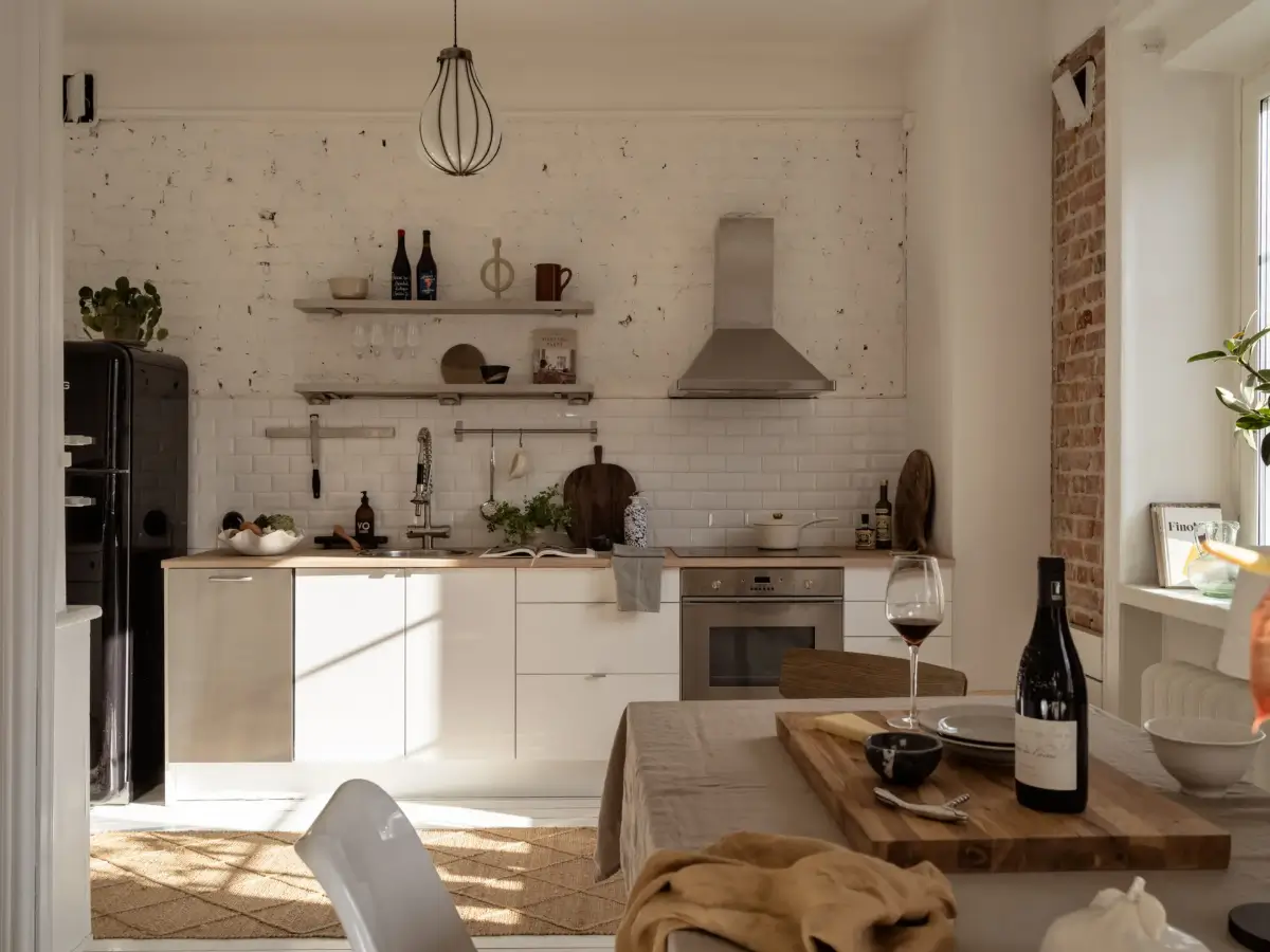 A Fresh 1920s Apartment with White Floorboards and Exposed Brick 8 kitchen white painted brick wall