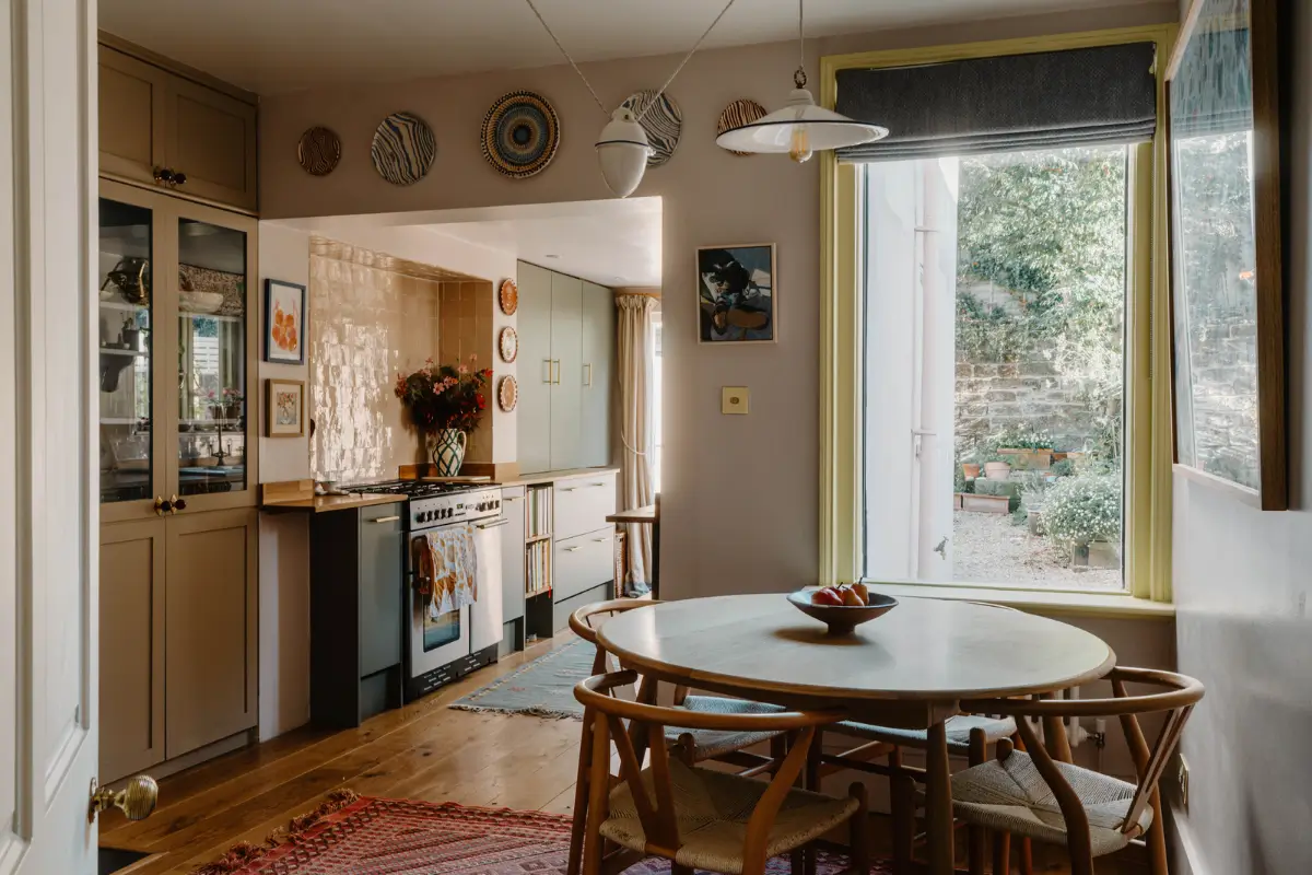Cozy Interiors in a Restored 19th Century Family Home in Tunbridge Wells 1 kitchen wooden floorboards zellige tiles round table wishbone chairs