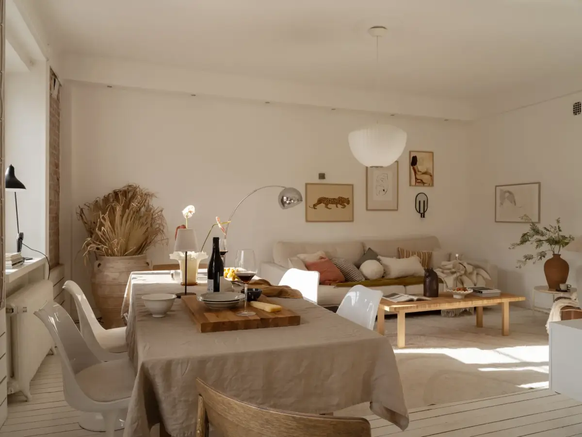 A Fresh 1920s Apartment with White Floorboards and Exposed Brick 2 light-colored living room