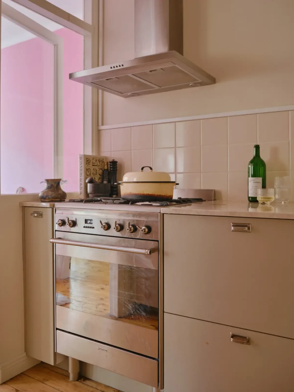 A Light 1930s Apartment with a Bubblegum Pink Bedroom 18 light gray kitchen cabinets 1 A Light 1930s Apartment with a Bubblegum Pink Bedroom