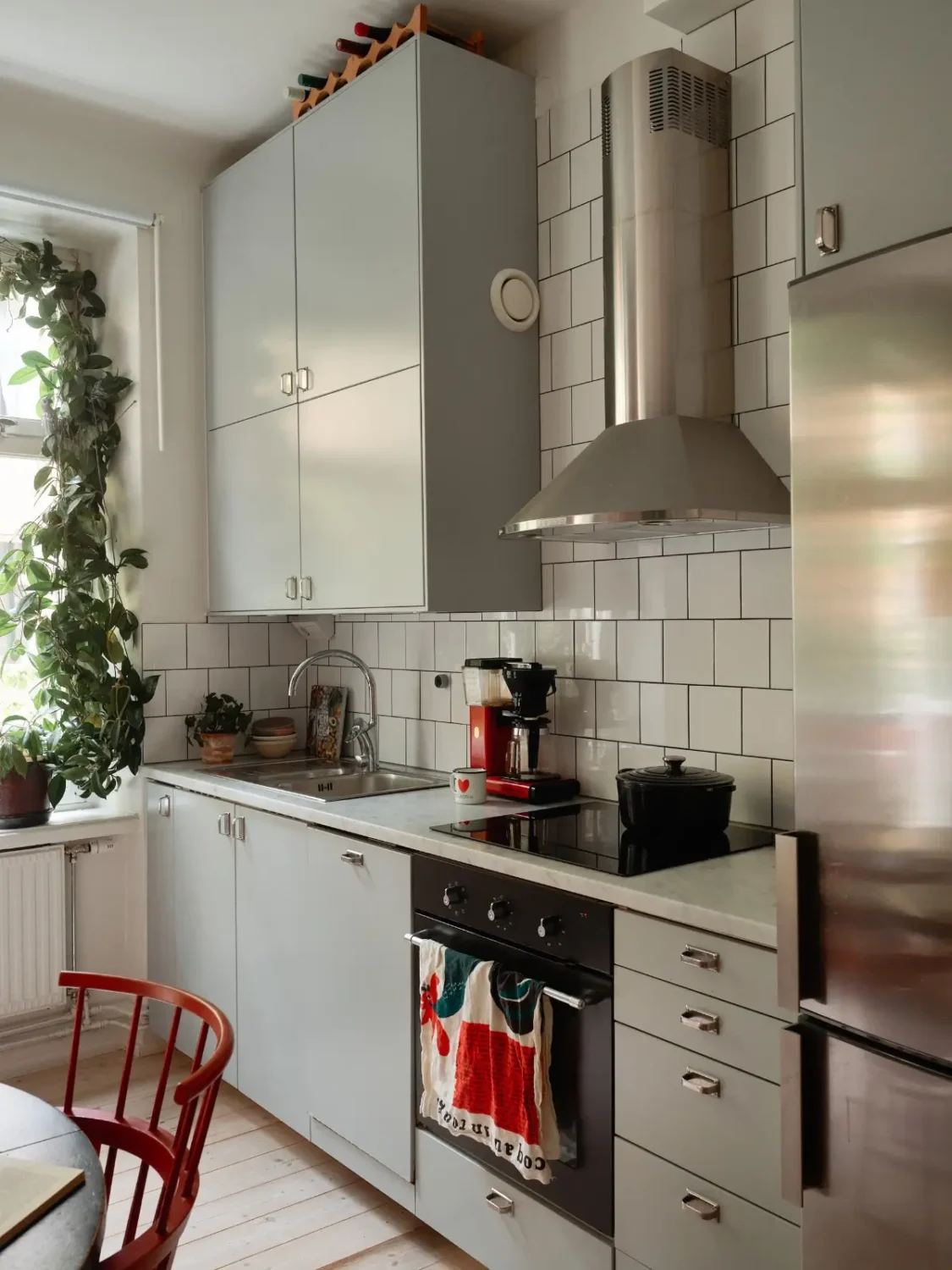 A Well-Planned Family Apartment with Historic Character 17 light gray kitchen marble countertop white backsplash tiles