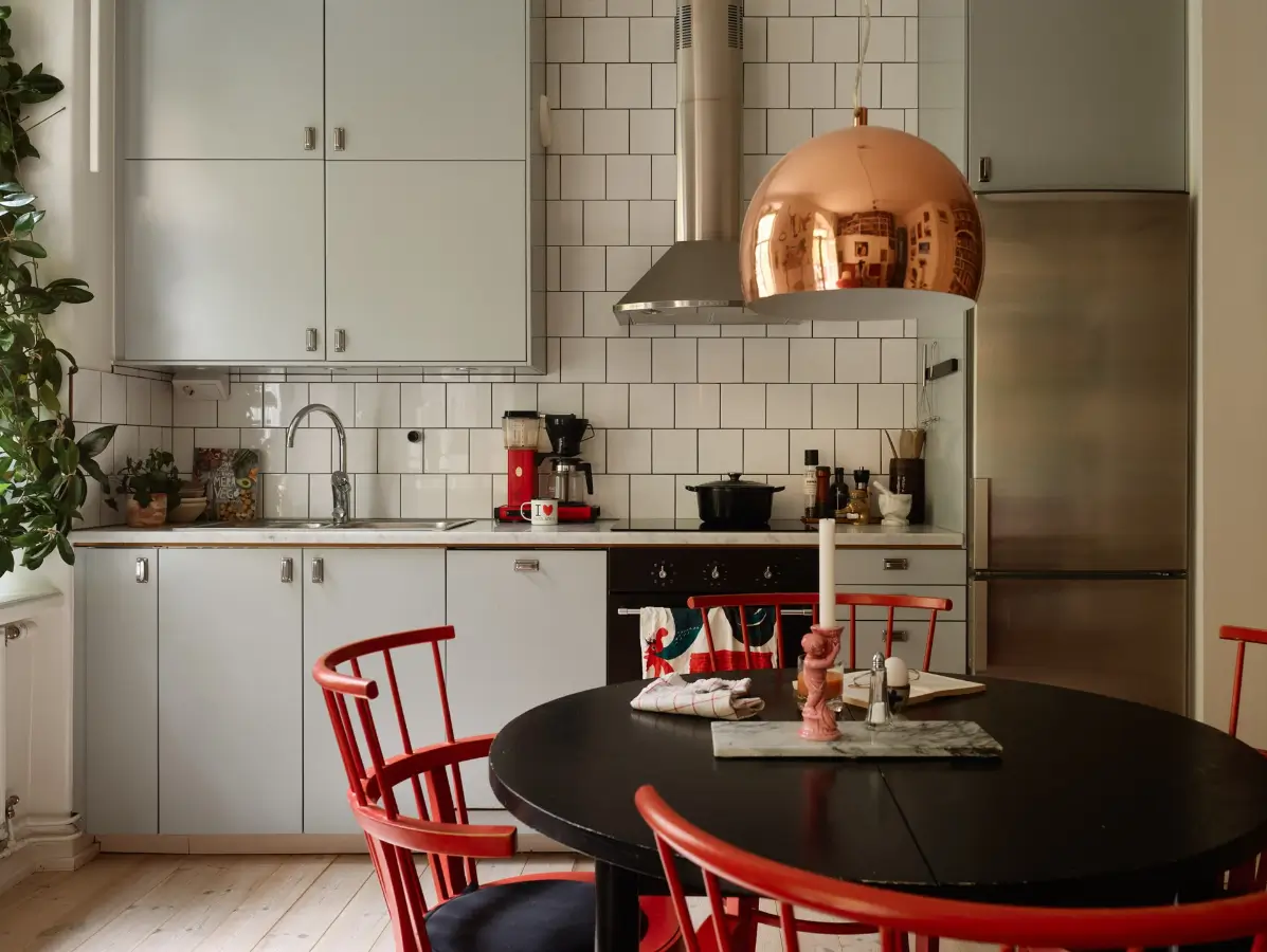 A Well-Planned Family Apartment with Historic Character 15 light gray kitchen round table with red chairs