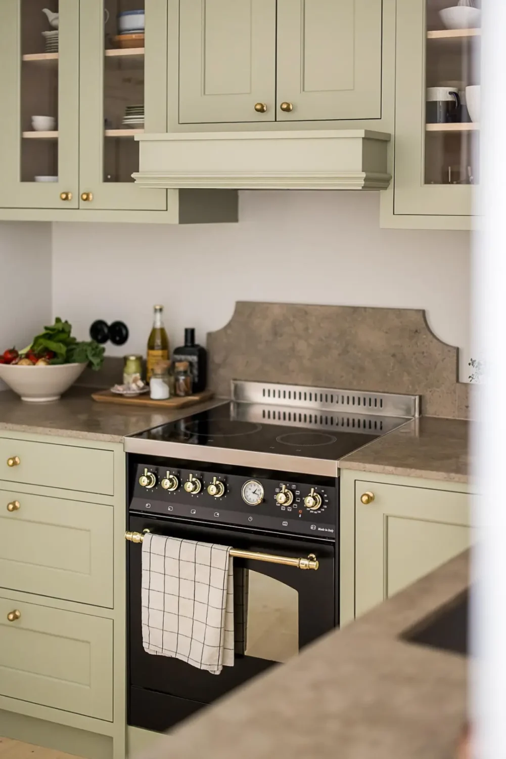 A Classic Renovated Apartment with a Social Light Green Kitchen 23 light green kitchen cabinets brass knobs