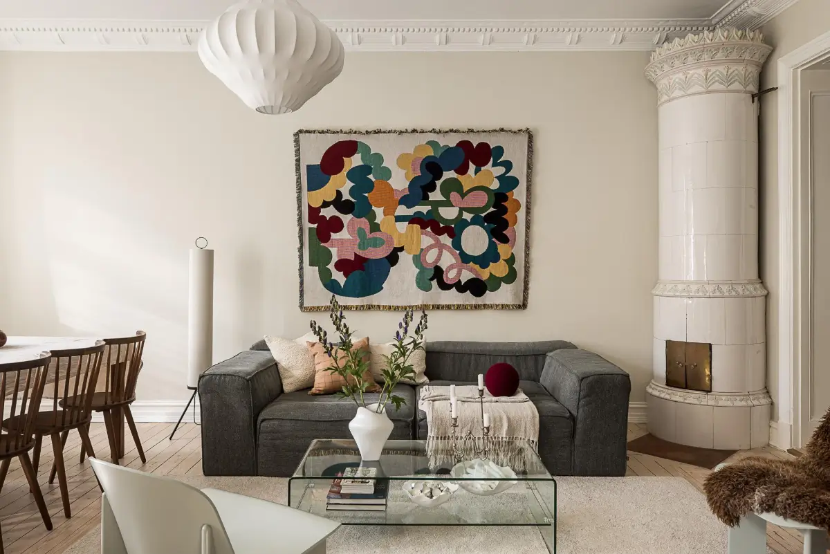 Warm Neutral Tones and Period Features in a Swedish Apartment 3 living room art