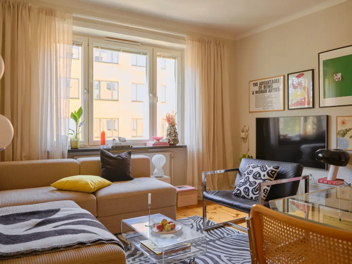 A Light 1930s Apartment with a Bubblegum Pink Bedroom 4 living room beige walls zebra rug
