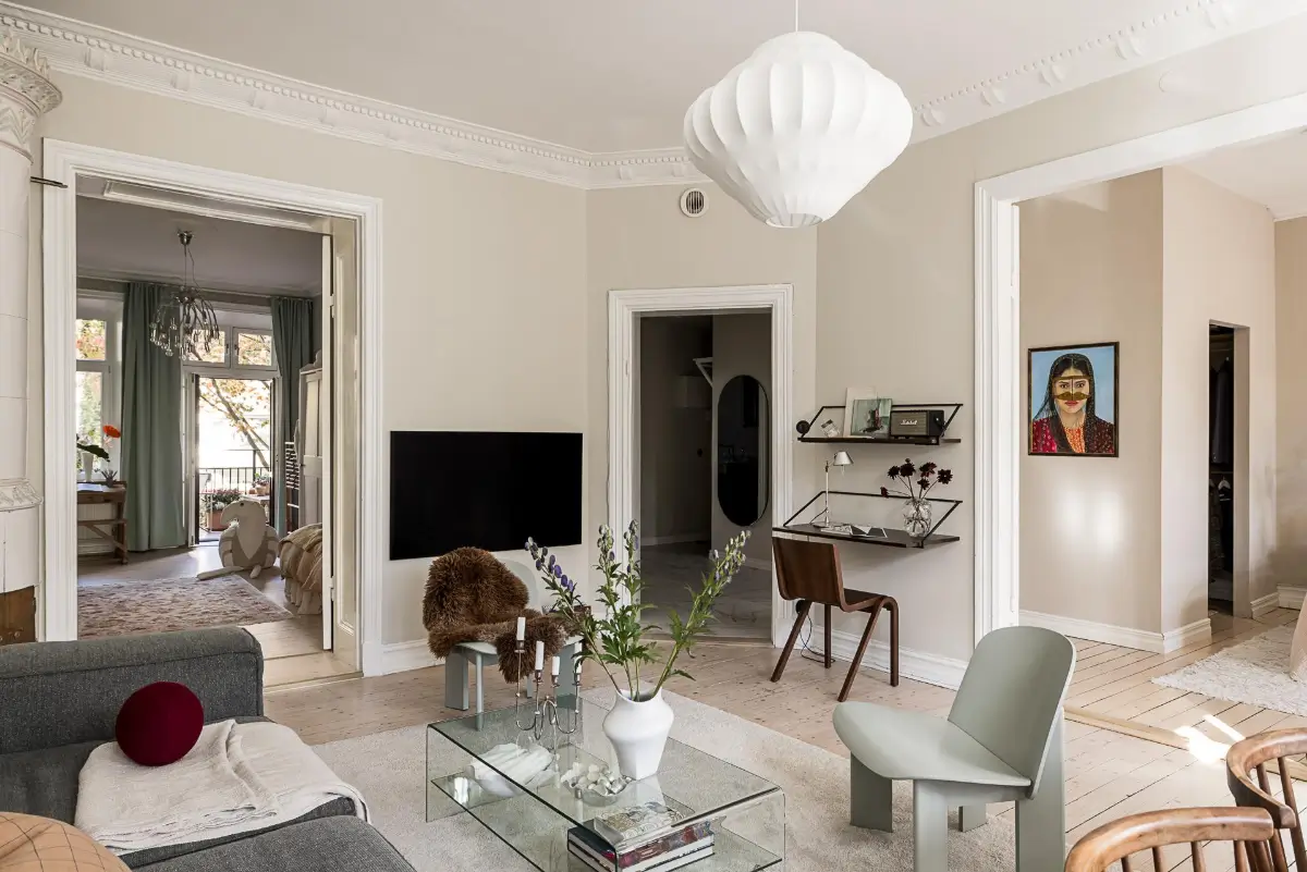 Warm Neutral Tones and Period Features in a Swedish Apartment 5 living room floating desk