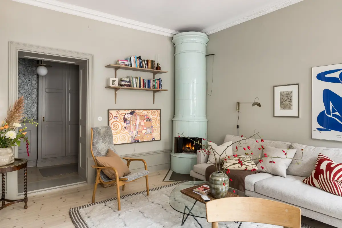 Gray Tones, Wallpapers, and a Mint Green Fireplace in a Swedish Apartment 8 living room gray walls mint green fireplace