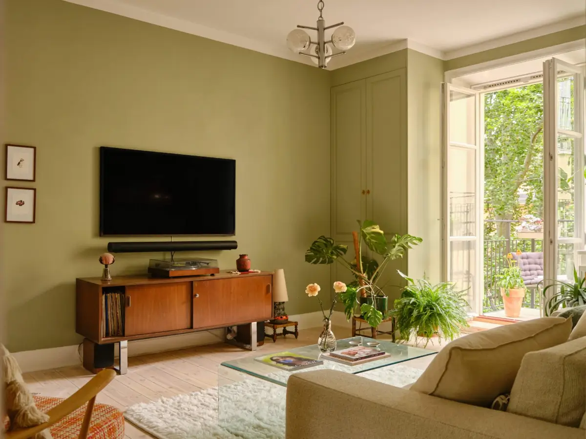 Green and Apricot Rooms in a Charming Stockholm Apartment 3 living room green walls built-in cabinets
