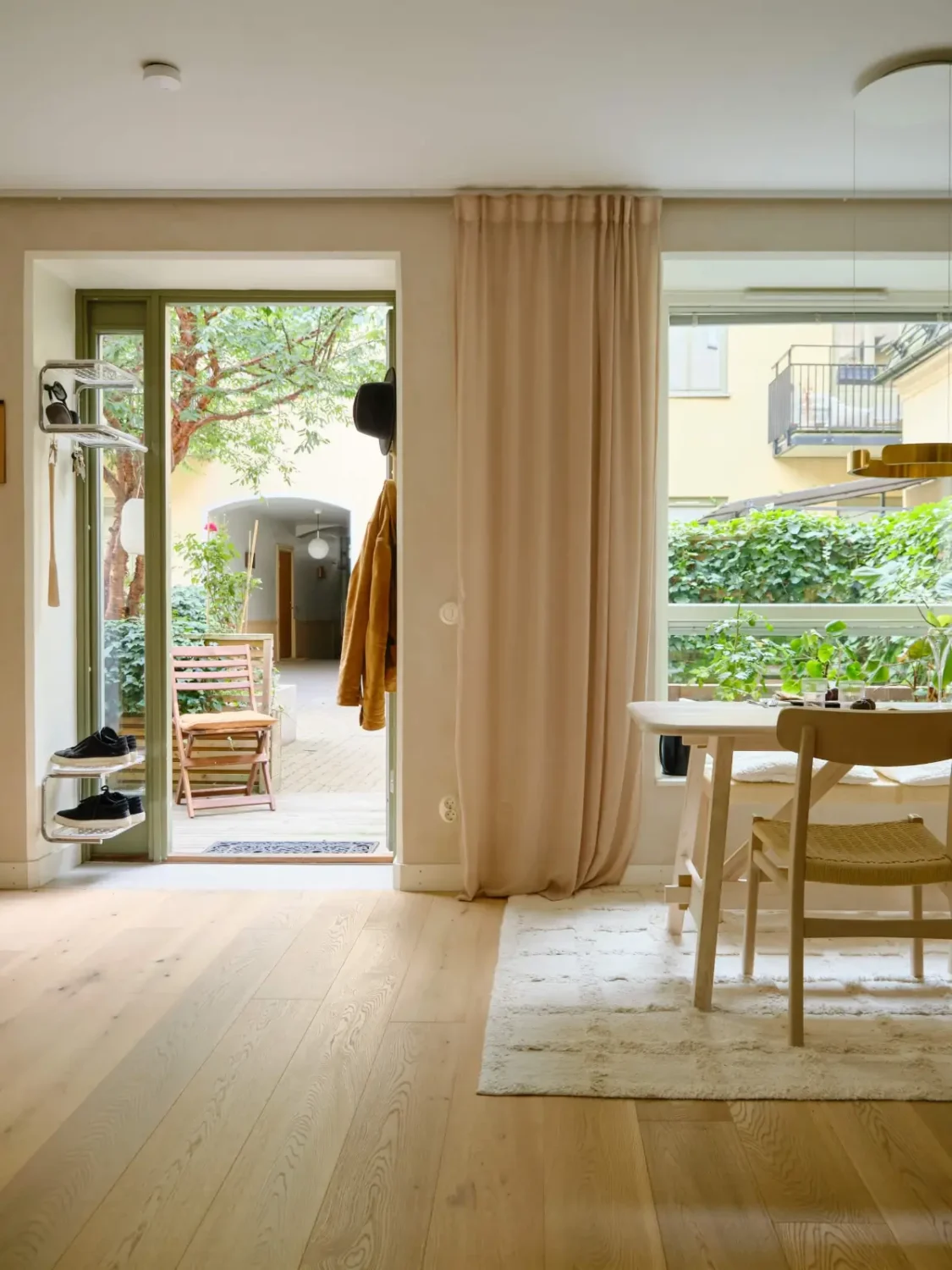 Former Stables Transformed into a Modern, Light House with Plaster Walls 4 living room large window