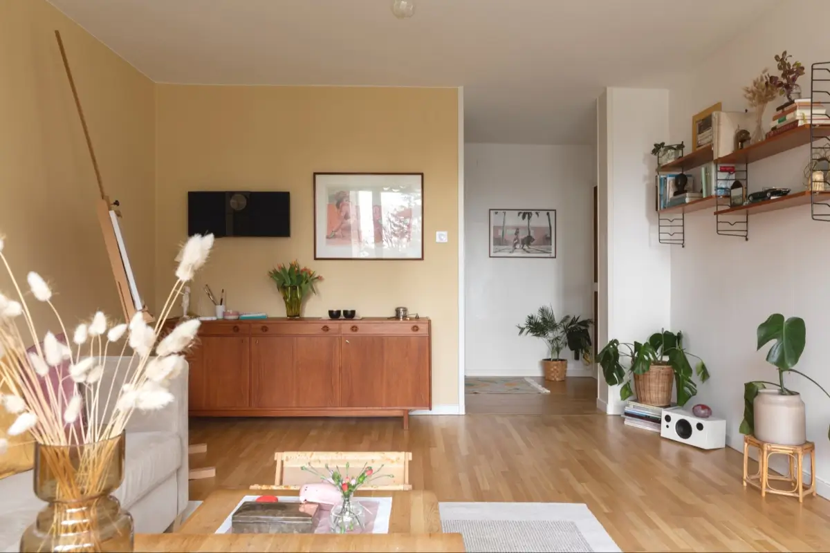 A Well-Preserved 1950s Apartment North of Stockholm 9 living room ochre yellow walls