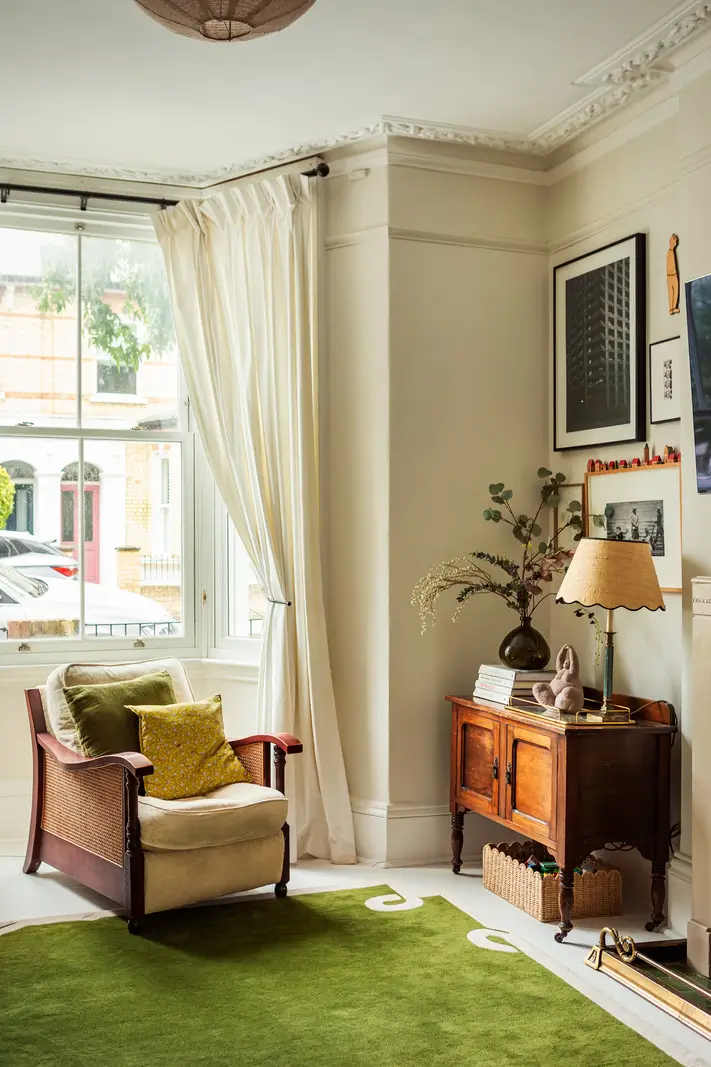 Period Elements and Subtle Color Accents in a Victorian Family Home 4 living room stucco green rug
