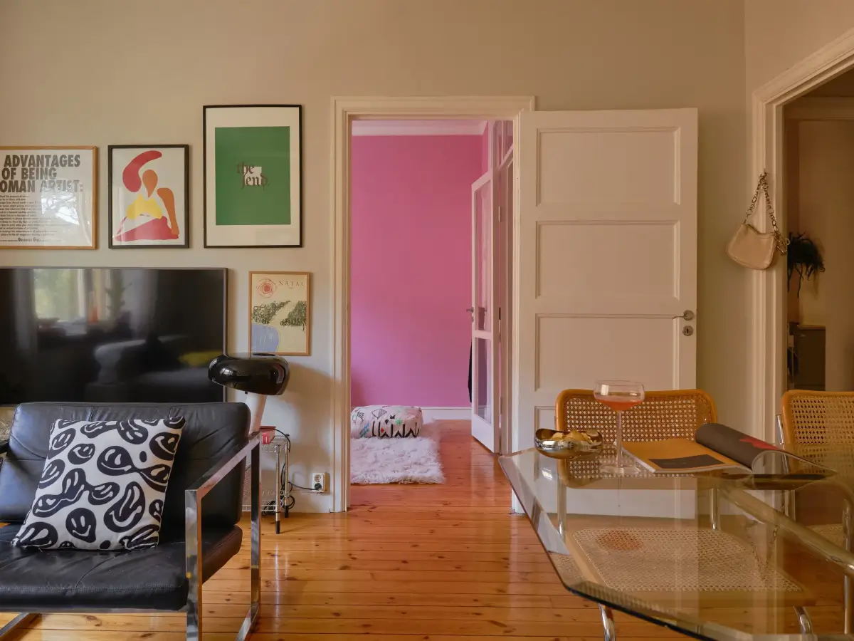 A Light 1930s Apartment with a Bubblegum Pink Bedroom 12 living room view into pink bedroom
