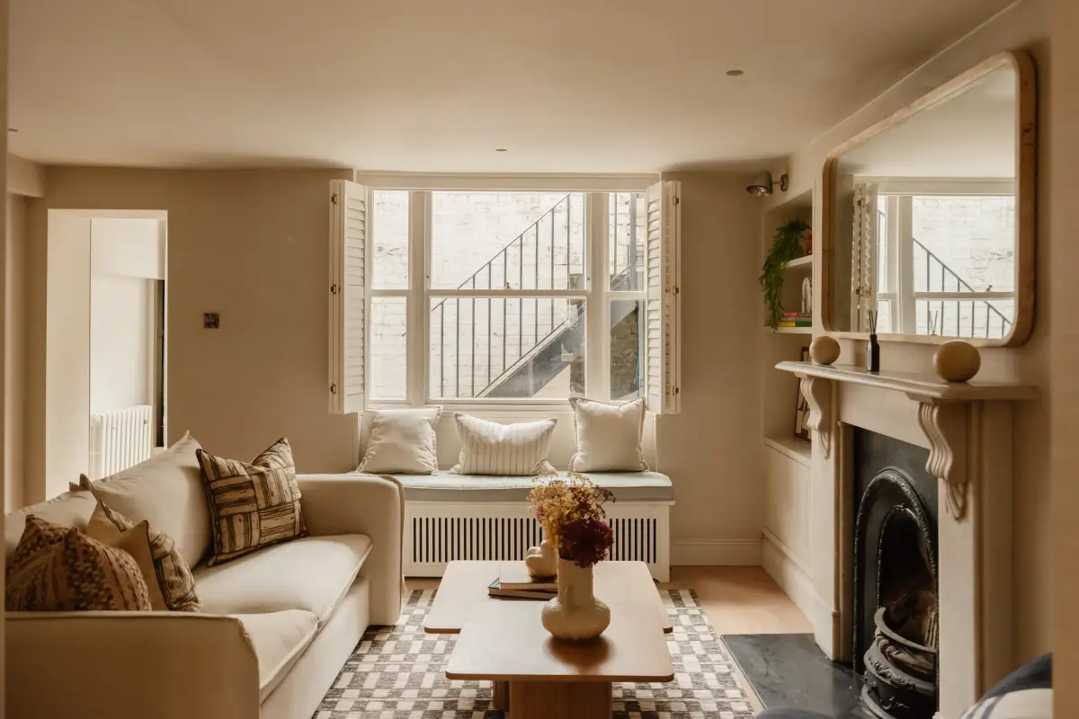 A Serene Duplex Apartment with a Glass Extension in London 2 living room with fireplace and window seat