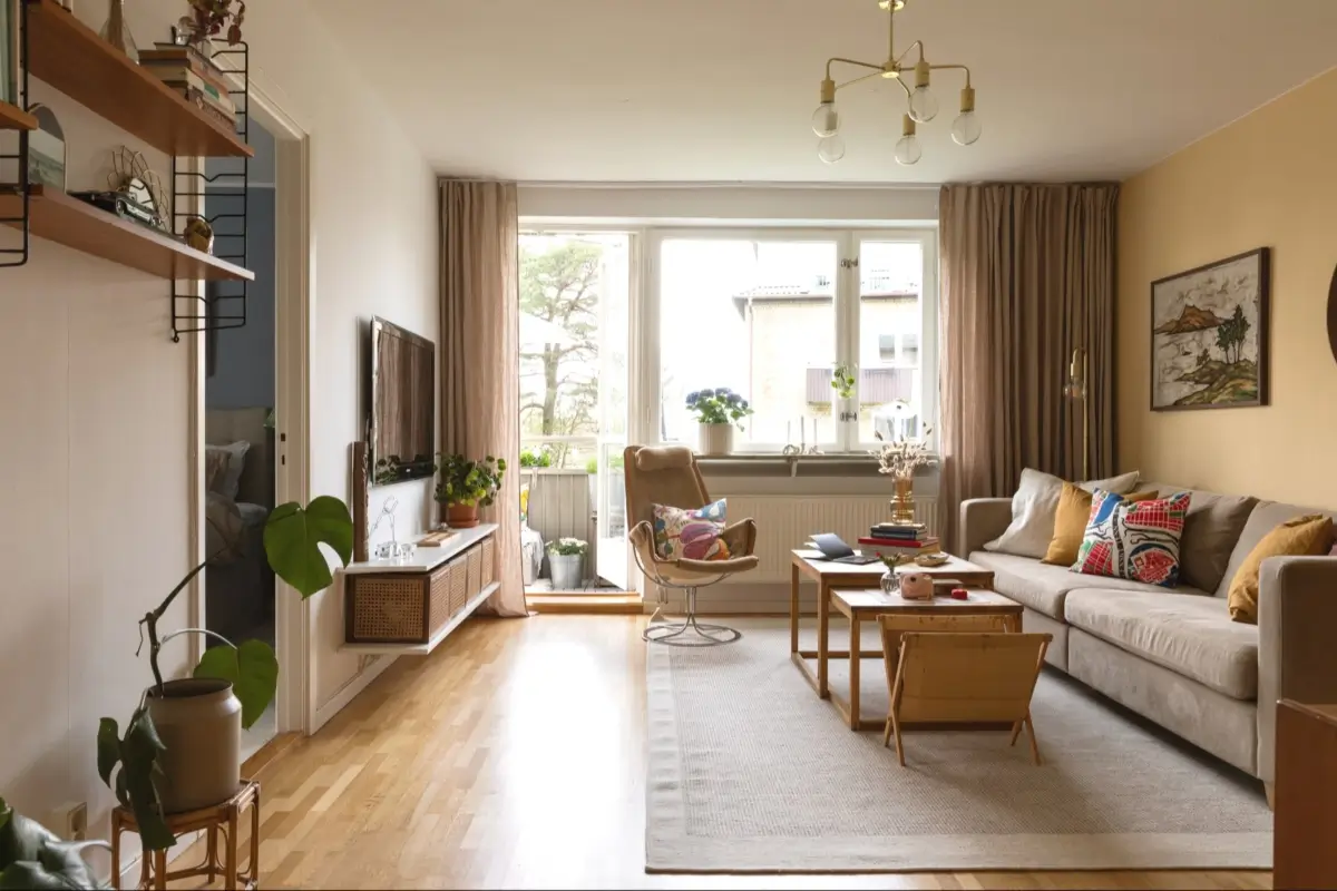 A Well-Preserved 1950s Apartment North of Stockholm 2 living room yellow wall large window