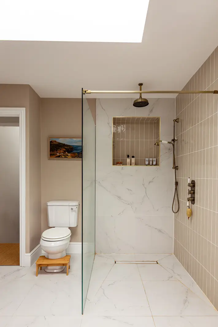 Period Elements and Subtle Color Accents in a Victorian Family Home 16 marble shower tiles beige-pink bathroom