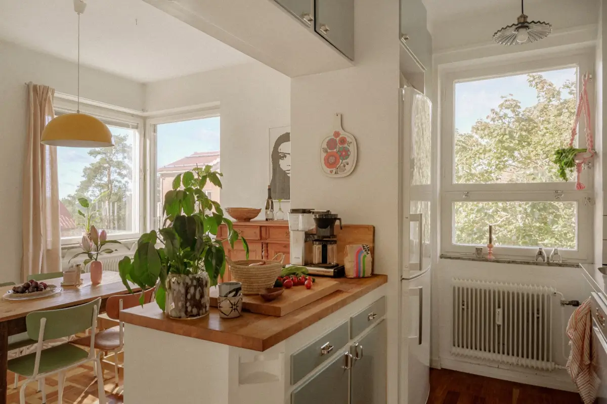Green Tones and Period Elements in a 1940s Apartment 8 midcentury kitchen dining table vintage chairs