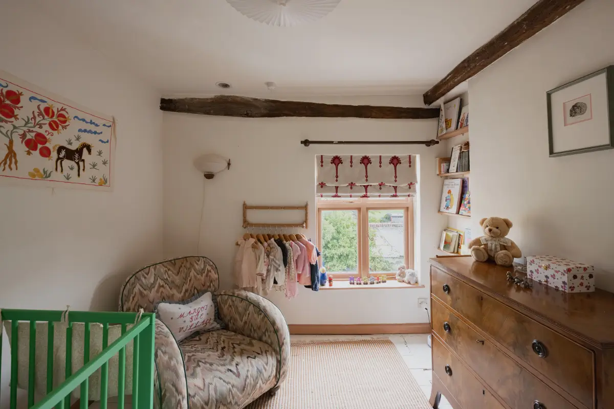 A Charming English Cottage with a Sage-Green Kitchen 19 nursery pink window frames