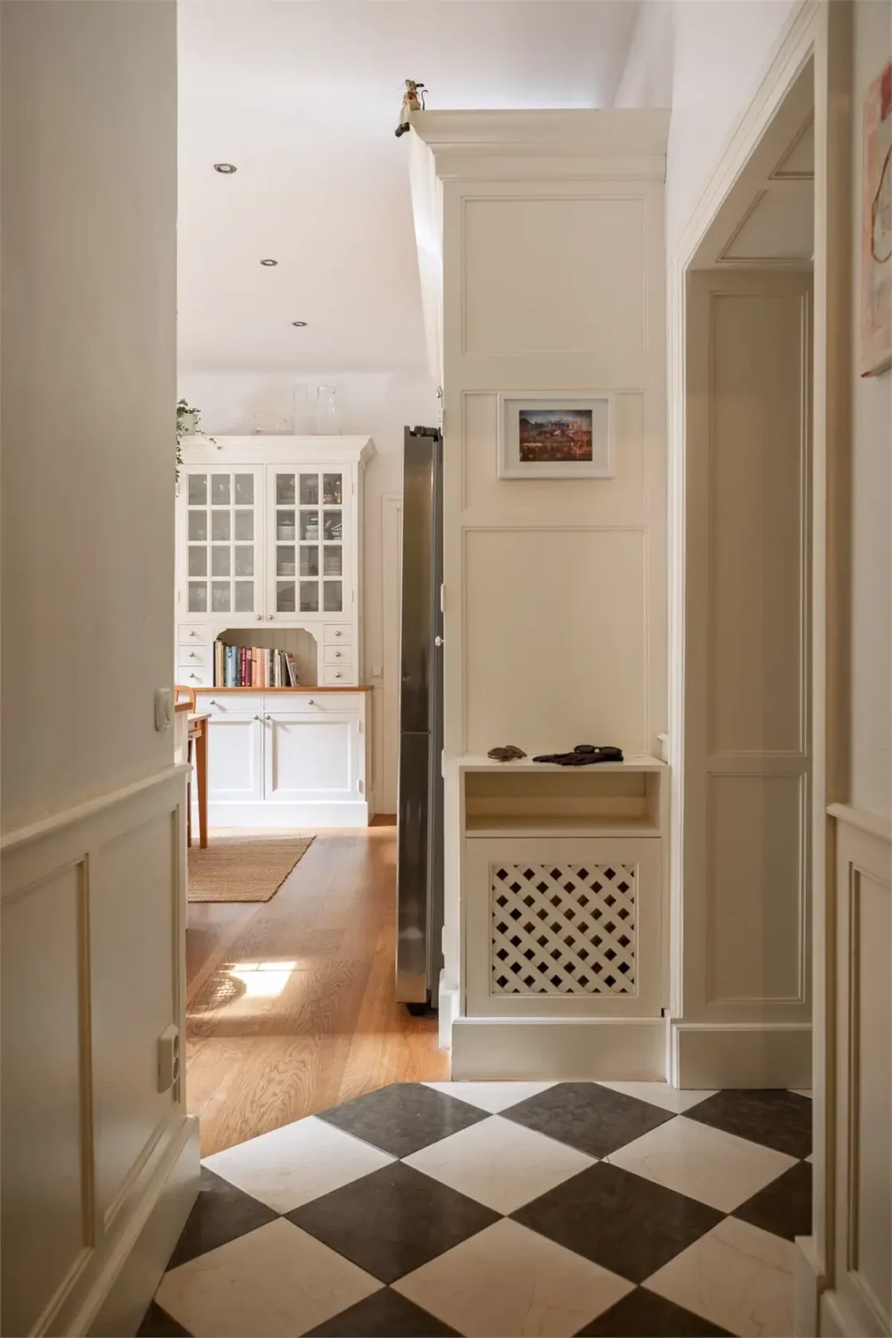A Light-Filled Stockholm Apartment with a Charming Kitchen 32 open hall black and white checkerboard floor