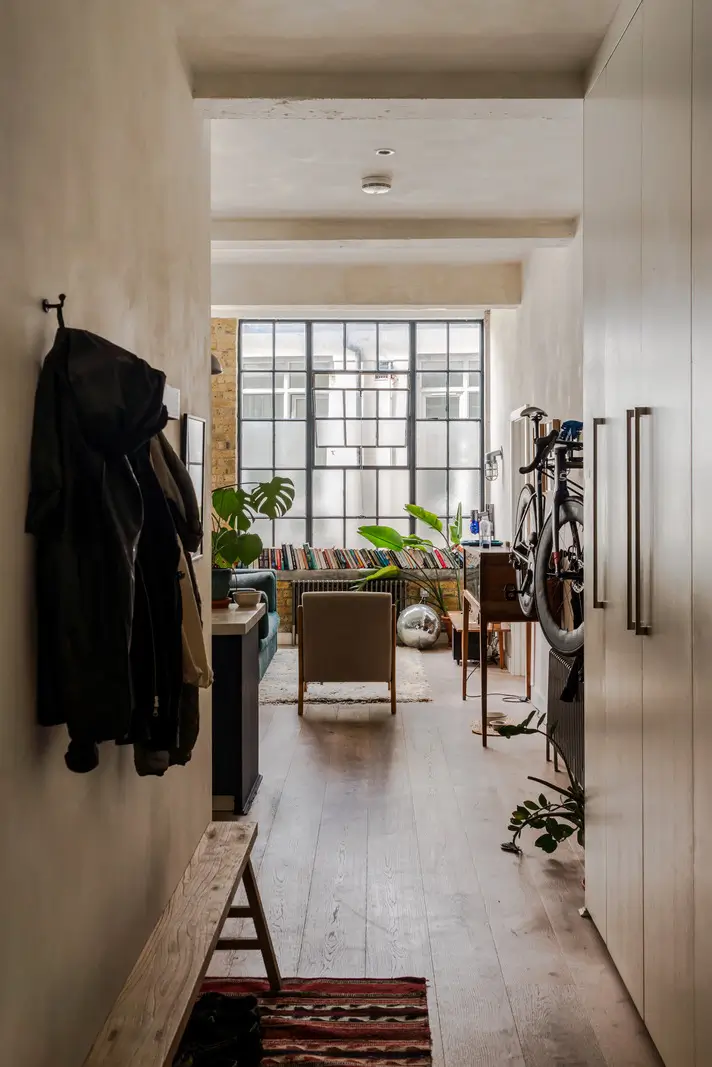 An Industrial London Apartment in a Former 1920s Shoe Factory 17 open hall living room factory windows