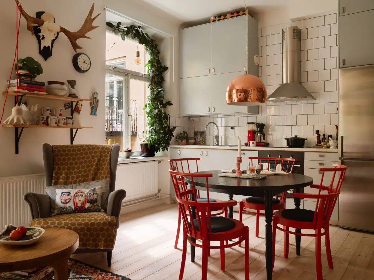 A Well-Planned Family Apartment with Historic Character 13 open-plan living space round table light gray kitchen