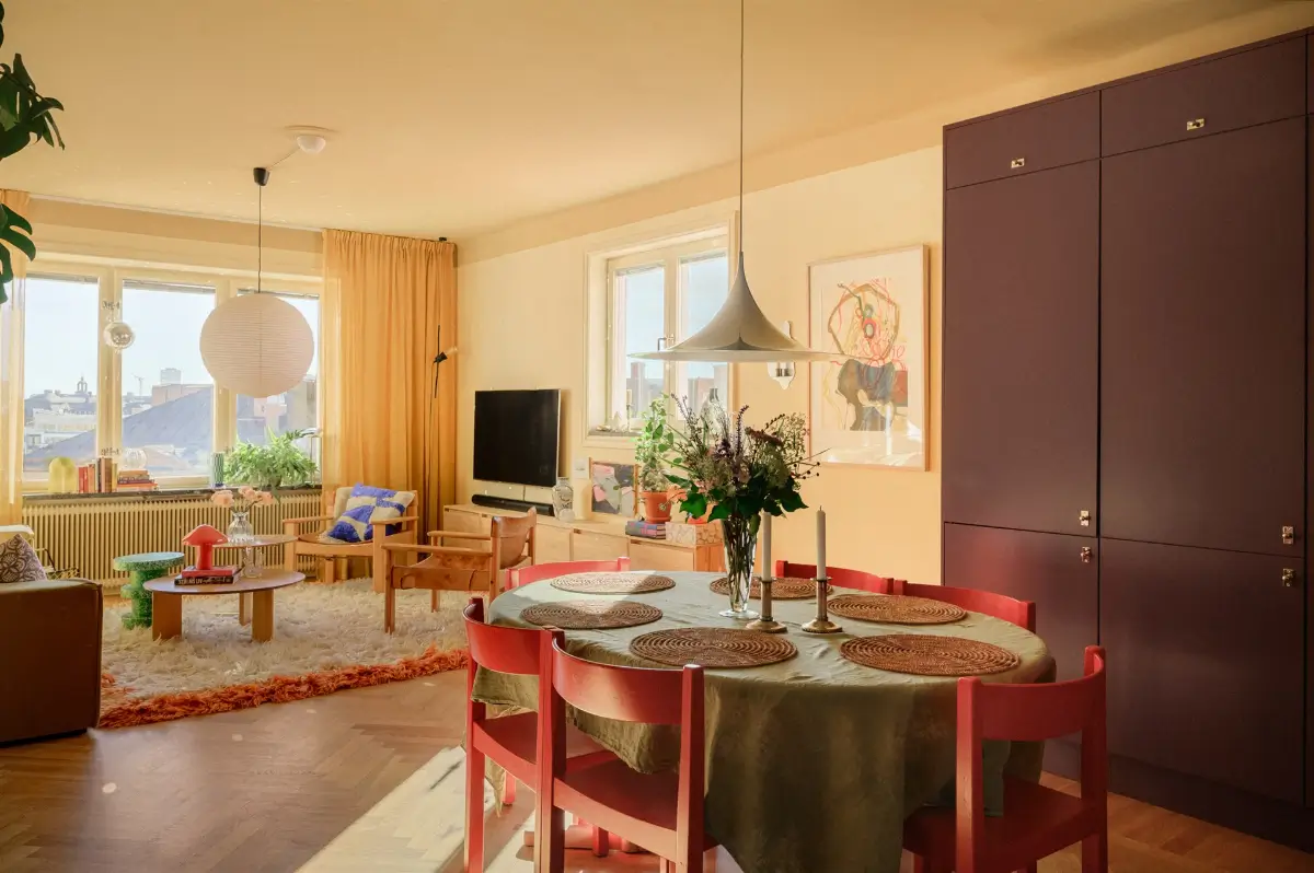 A Colorful Stockholm Family Apartment with Views of the Lake 8 open-plan scandinavian living space herringbone floor plum kitchen nordroom