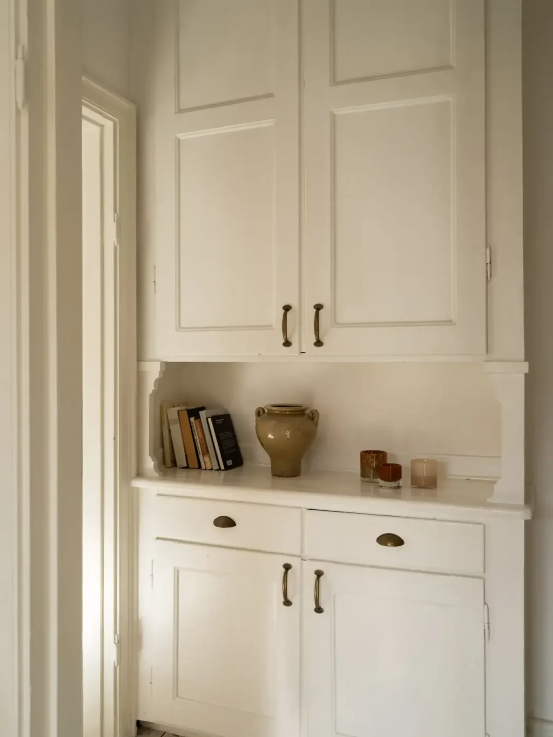 A Fresh 1920s Apartment with White Floorboards and Exposed Brick 21 original cabinet