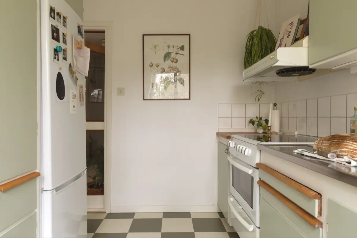 A Well-Preserved 1950s Apartment North of Stockholm 13 original midcentury kitchen light green cabinets