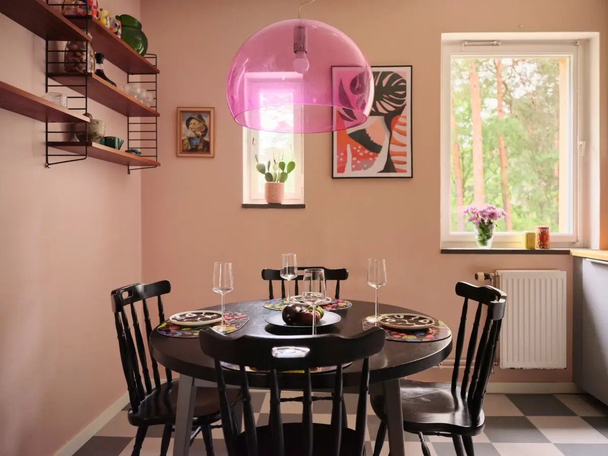 A Natural Color Palette in a Swedish 1940s Apartment 19 round black kitchen table pink pendant