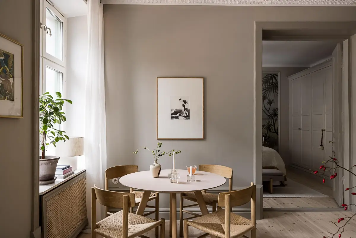 Gray Tones, Wallpapers, and a Mint Green Fireplace in a Swedish Apartment 7 round dining table