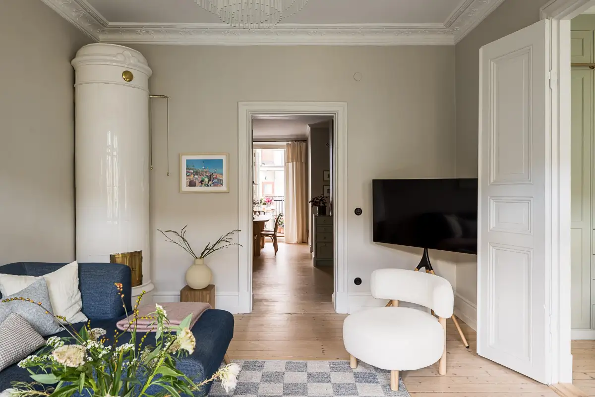 A Classic Renovated Apartment with a Social Light Green Kitchen 6 scandi living room
